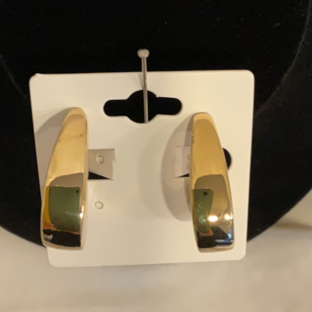 Napier high polished gold tones few back clip earrings.